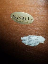 The metal tag under the table, along with the remnants of the paper label