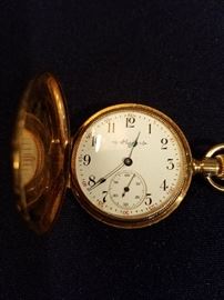 The dial on the woman's watch.  Watch is not in working order