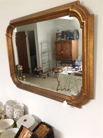 Wall mirror with gold frame
