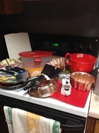 Kitchen items, copper mold, red mixing bowl, etc.
