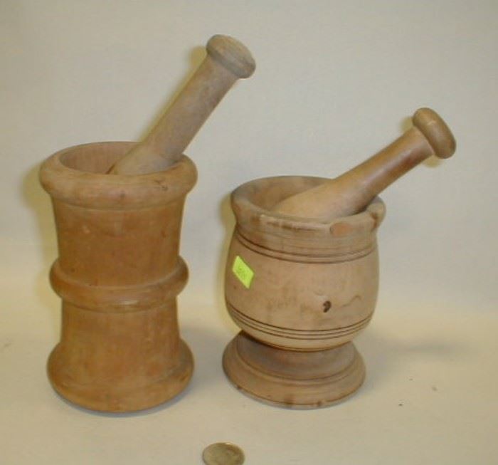 two wooden mortar and pestles
