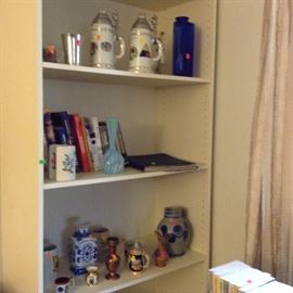 larger book shelf and German steins