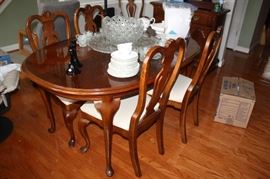 Cherry dining room table that seats 10.  Has 6 chairs