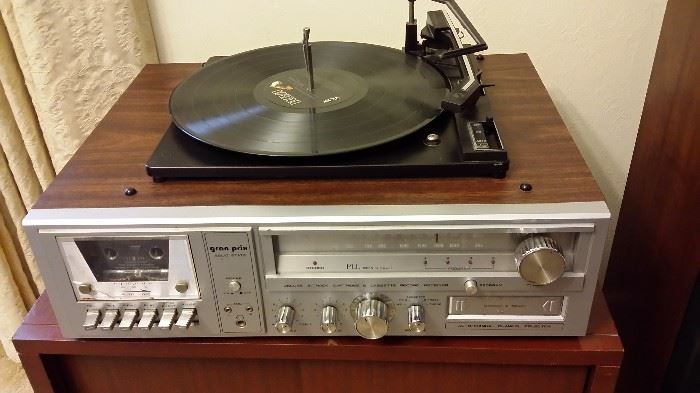 Gran Prix stereo with turntable (works), 8 track tape player (works), cassette tape player (needs some TLC)