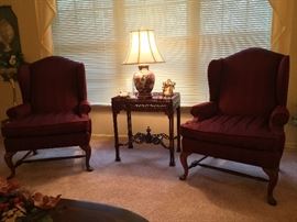 Close-up of Fairfield wing back chairs and oriental lamp with matching round plate.