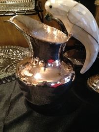 Mexican silver pitcher with parrot handle