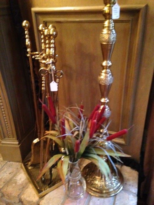 Brass fireplace tools and large brass candle holder