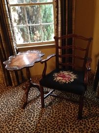 Three-legged scalloped table; arm chair with  needlepoint seat