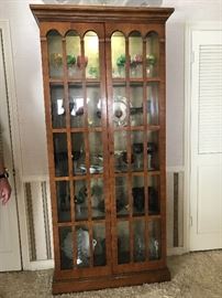 Nice, tall display cabinet with 2 paned doors 