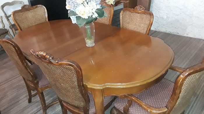 Vintage Table with leaf and 6 Rattan Backed Chairs new upholstery.