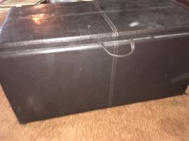 This piece doubles as a bench to sit on and storage -- very practical.