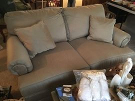This is one of two matching Sealy love seats in "champagne" colored fabric.