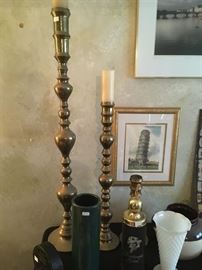 This is a beautiful three-piece brass candle holder set.