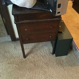 This piece is cute -- a little two-drawer table -- needs a little tlc -- nice project piece.