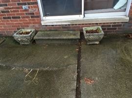 Two nice cement planters.