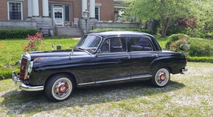 1958 4-door Mercedes Model 219 with Rolls-Royce front. Black with white interior trimmed in red. 