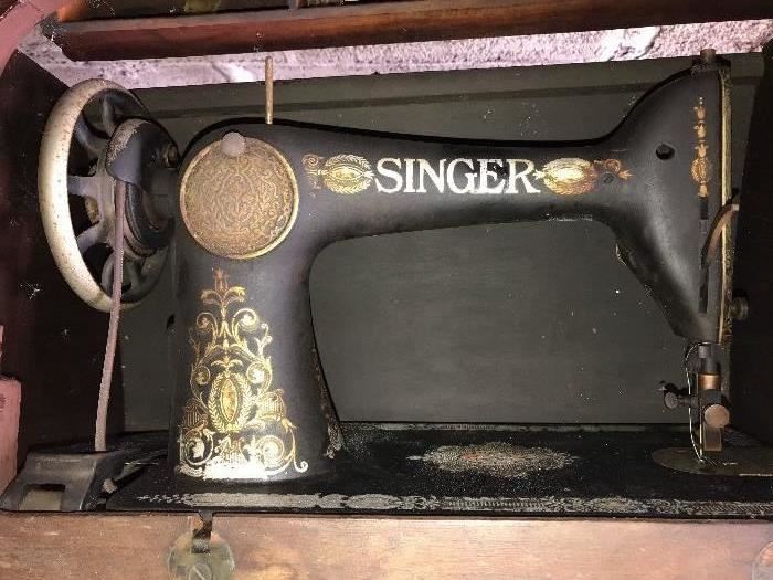 Vintage Singer sewing machine and cabinet.......