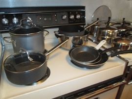 Calphalon, T-Fal and Farberware pots and pans.