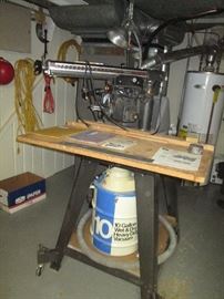Craftsman 10" radial table saw.  Comes with sawdust attachment and 10 gal shop vac