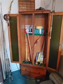 gun case fishing poles archery bow and arrow golf balls