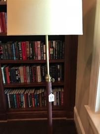 This floor lamp has a little leather on it - you just don't see that every day.  It's a study, library, den lamp for sure!