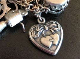 close up of a charm on vintage charm bracelet 