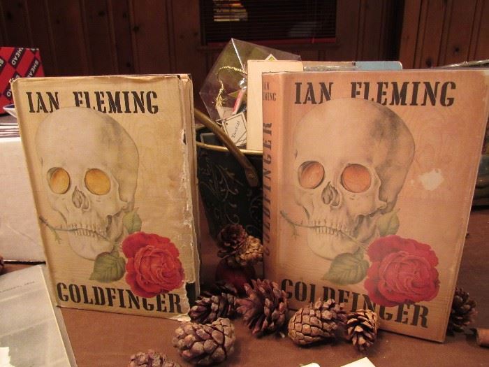James Bond Memorabilia including one of the two 1959 First Edition "GoldFinger" with dust jackets published in London by Jonathan Cape. A 1st Edition, U.S. printing also for sale.