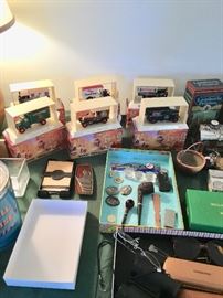 Matchbox model cars, belt buckle, pipes