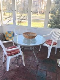 Patio set, metal and glass table and 3 plastic patio chairs