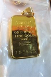 Gold. One ounce bar turned into jewelry.