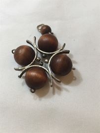 Wood bead pendant with silver support brackets