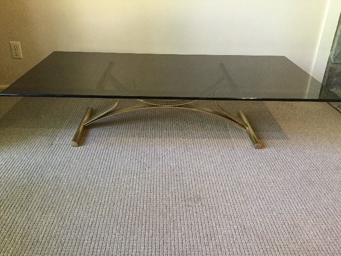 Contemporary Glass-topped coffee table with brass toned base
