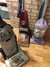 Vacuum cleaners and rug cleaners 