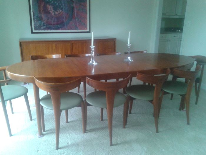Mid Century Modern, Teak and bought in Germany in 1960. Table with 2 inserts, Credenza, 10 unique and collectable Chairs. This Set has a reserve price