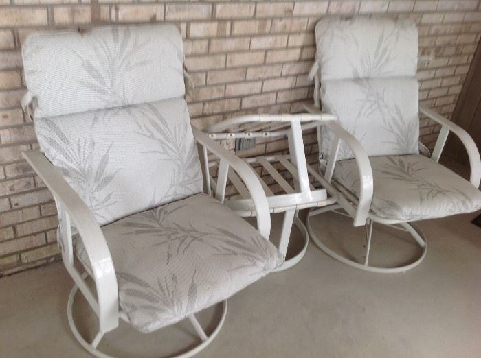 Outdoor Swivel Chairs $ 50.00 each (4 available) - includes cushions as seen.