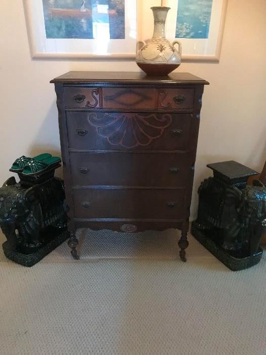 Antique chest of drawers with pair of ceramic elephant plant stands