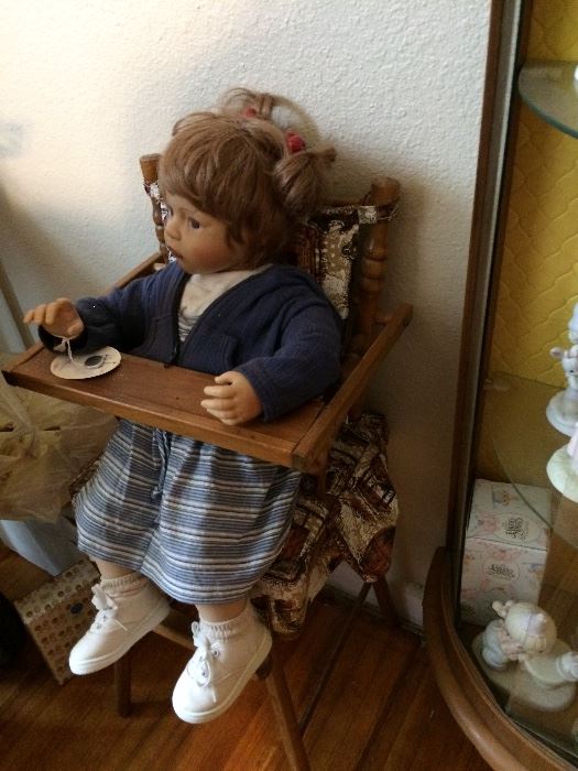 Antique wooden highchair with doll