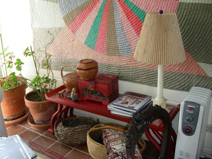 Baskets, plants, quilt, alabaster lamp, red coffee table