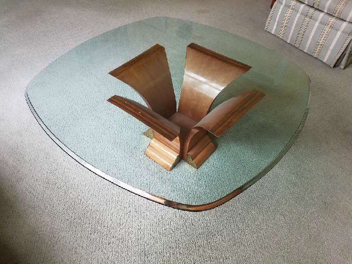 Unusual glass coffee table with modernist wooden base
