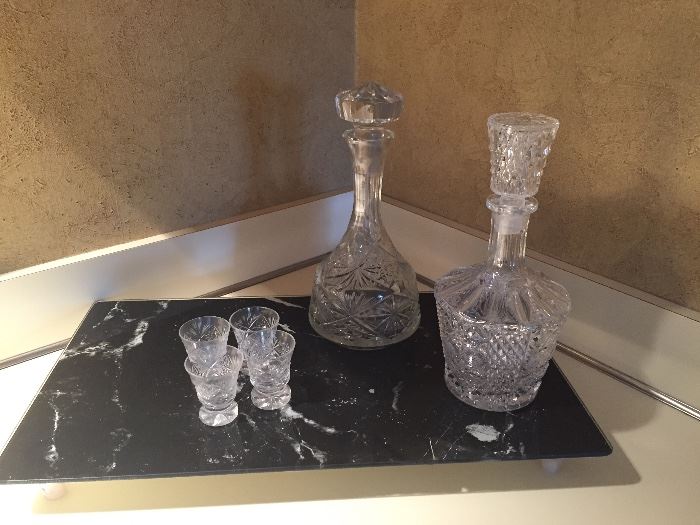 Decanters, marble cheese board and shot glasses