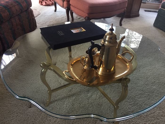 Brass and glass coffee table, brass tea set and collection of prints