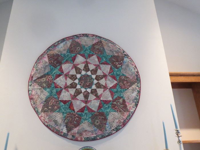  A hand made large round quilt.