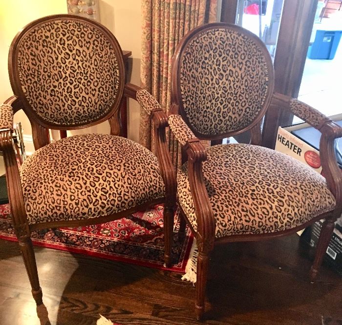 2 wood Arm Chairs with leapord Upholstered Seats & backs.  