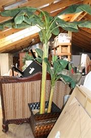 Artificial tropical banana tree in a large container