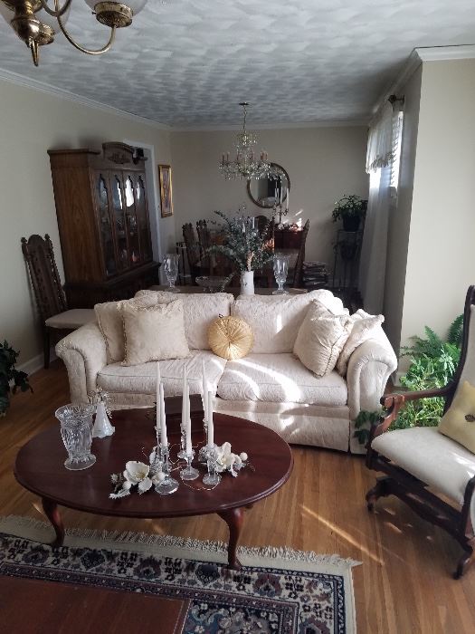 White Couch and cherry table. Room full of cherry furniture, antiques  and more.