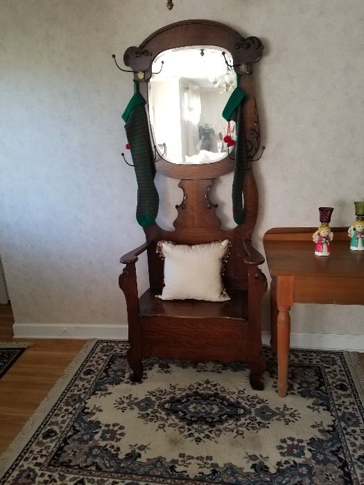 This Antique Hall tree is in great shape. We kept our family photos in it for years.. This is one piece I hate to sell, but it won't fit in my house.