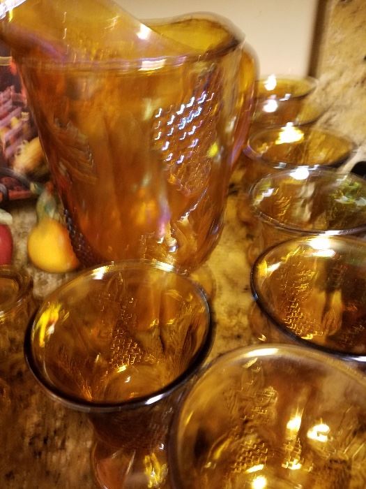 Beautiful Complete Set of Amber Carnival glasses with matching pitcher. Eight goblets.