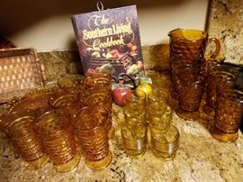 Great set of Mid-Century Amber glasses. There are two complete sets of tumblers, six juice glasses and a matching pitcher.