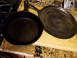 Several cast iron skillets.