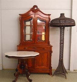 Mahogany display cabinet, parlor table, wicker floor lamp
